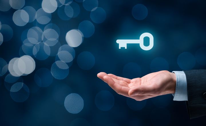 Key Icon Hovering Above Hand